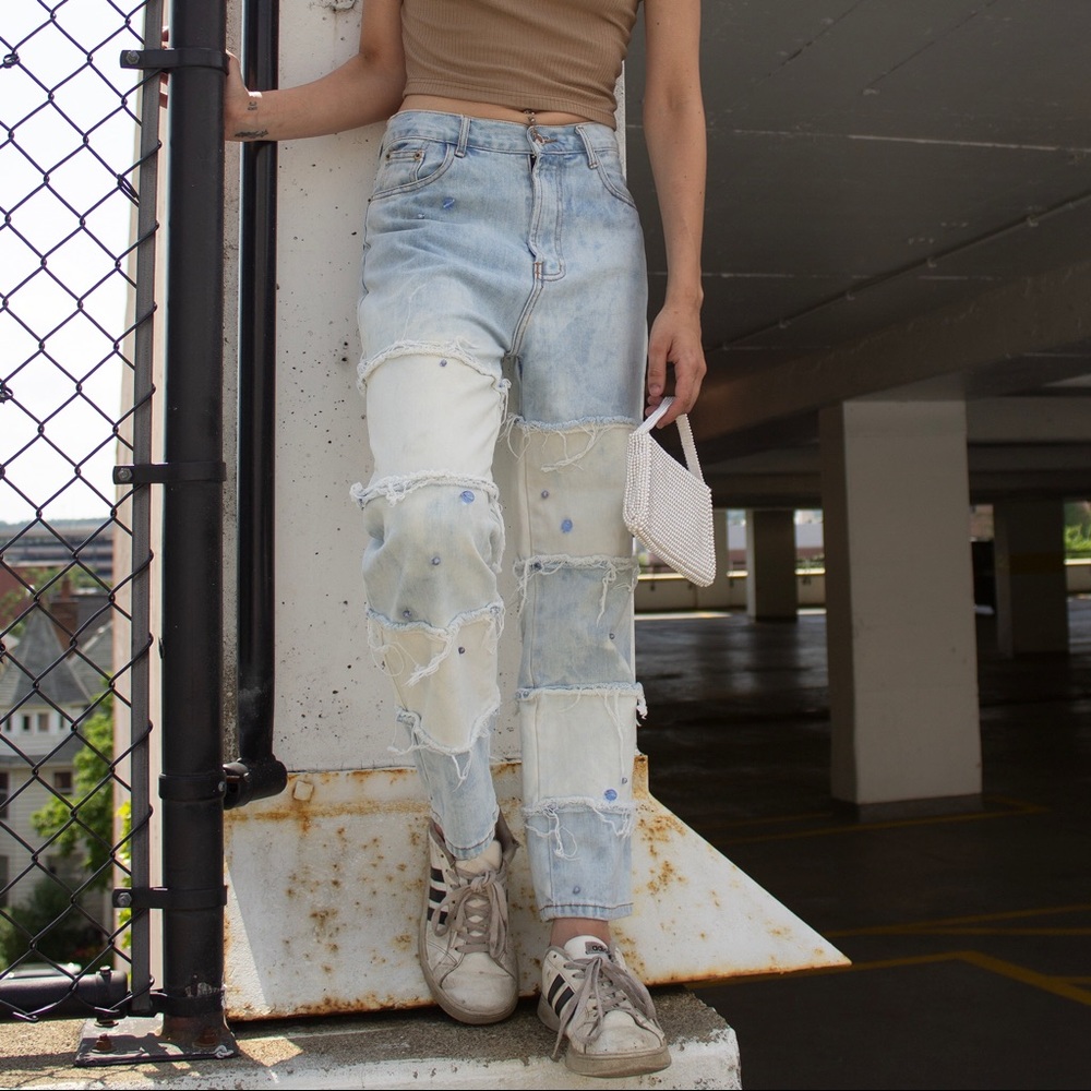 hand bleached and reworked denim jeans